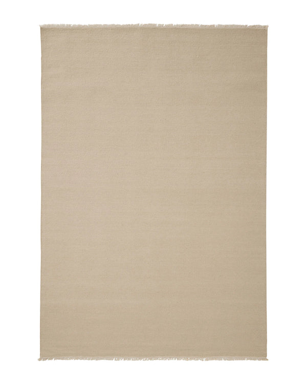 Jacqueline Cashew wool rug in cream with sandy undertones, hand-woven flatweave construction and raw fringe border by Weave Home