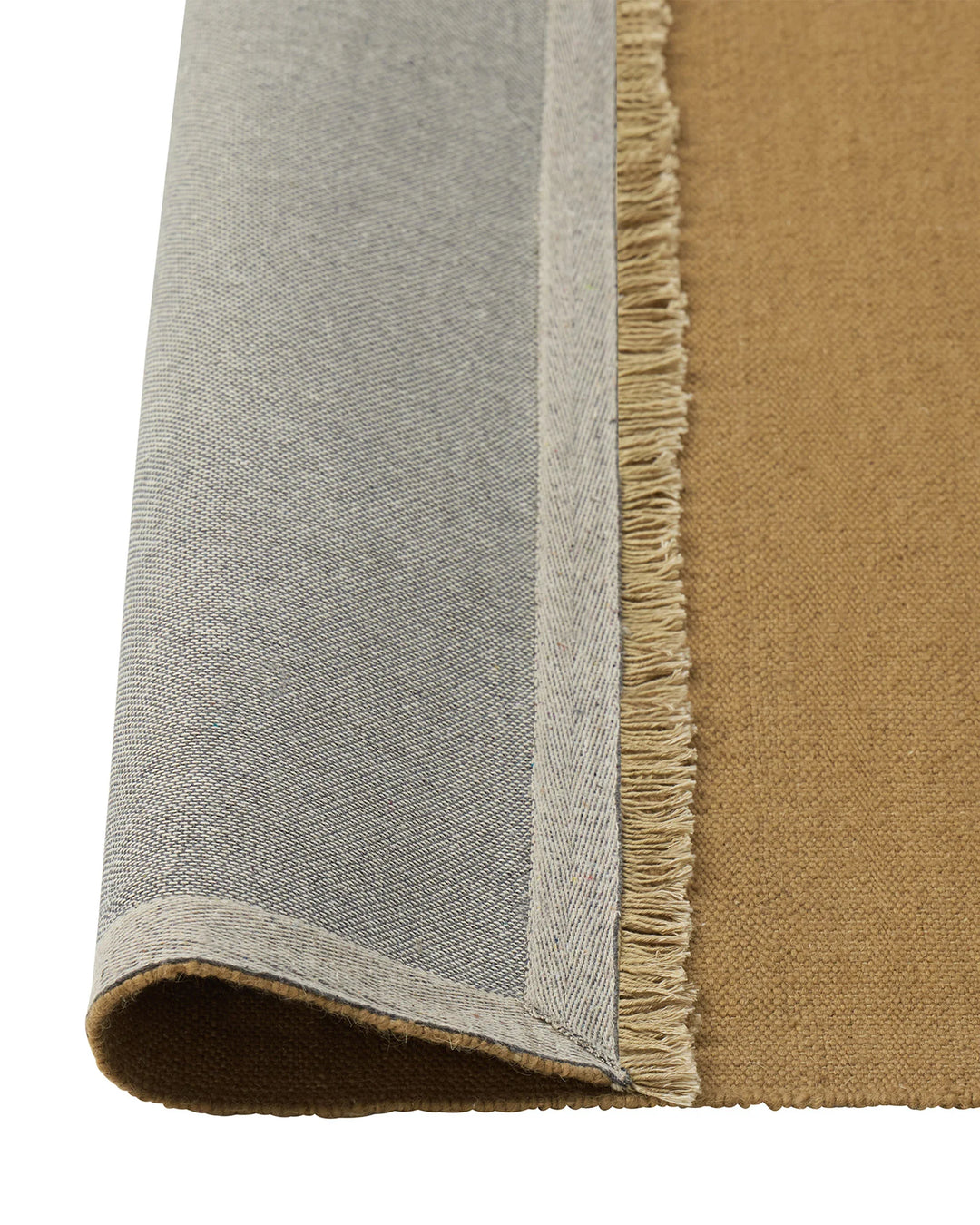 Jacqueline Brulee rug detail view showing wool flatweave texture and hand-knotted fringe edge by Weave Home
