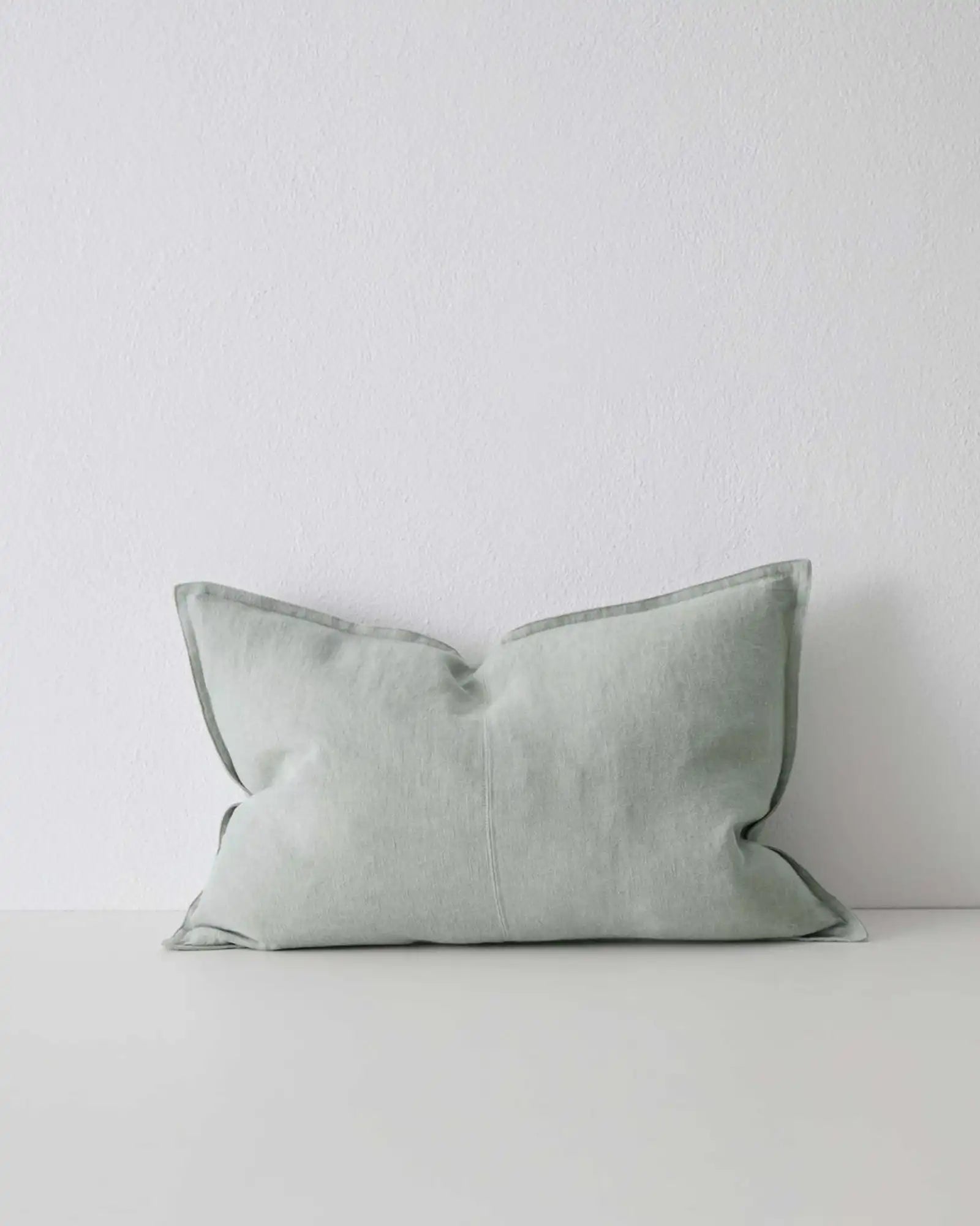 Como Laurel 40x60 eucalyptus green-grey linen cushion cover with piped edge detail by Weave Home