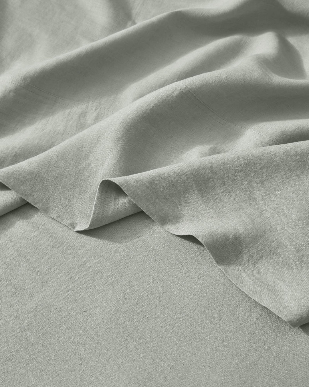 Ravello Flat Sheet in sage, European linen with soft prewashed finish and relaxed drape by Weave Home