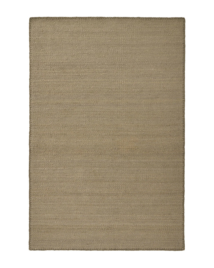 Monroe Flint rug in soft earthy green with muted grey undertones, woven polyester with blanket stitch detail, by Weave Home