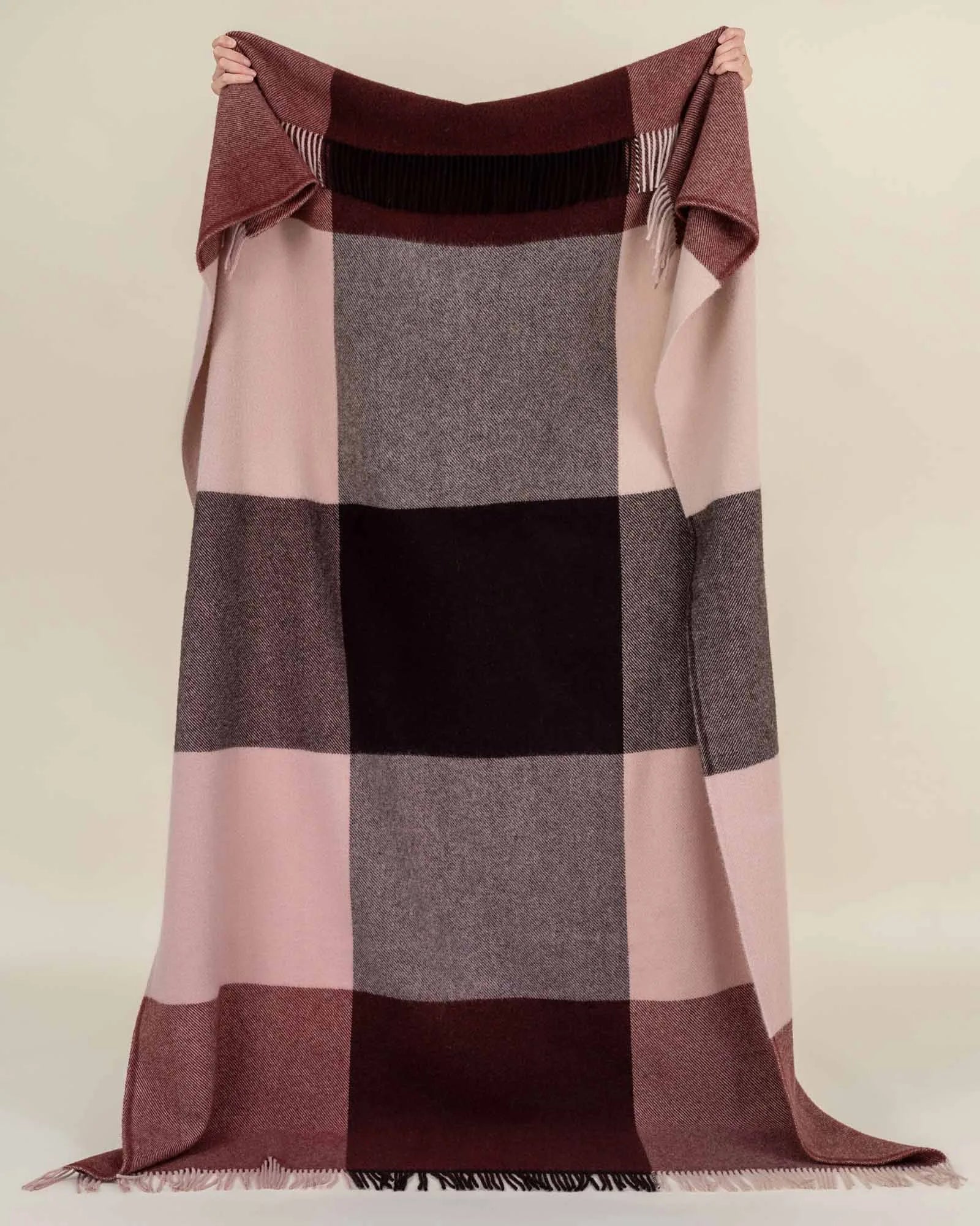 Syracuse Brookside Beetroot throw in berry, chocolate and pink large check pattern with fringe trim, held up by Weave Home