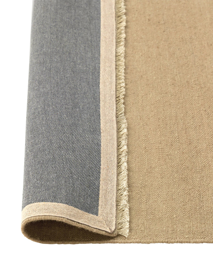 Jacqueline Barley wool rug detail showing fringe edge and flatweave texture in soft sand neutral, by Weave Home