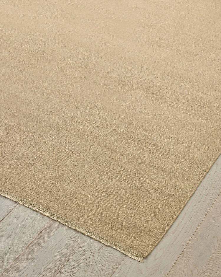 Jacqueline Barley high-traffic wool rug in soft sand, 3m x 4m, showing flatweave construction and fringe edge by Weave Home