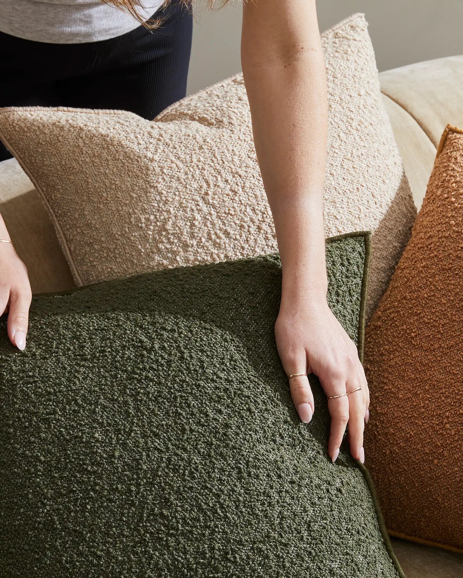 Alberto Olive bouclé cushion 50x50cm with soft-touch texture and babylock edge, styled with coordinating cushions by Weave Home