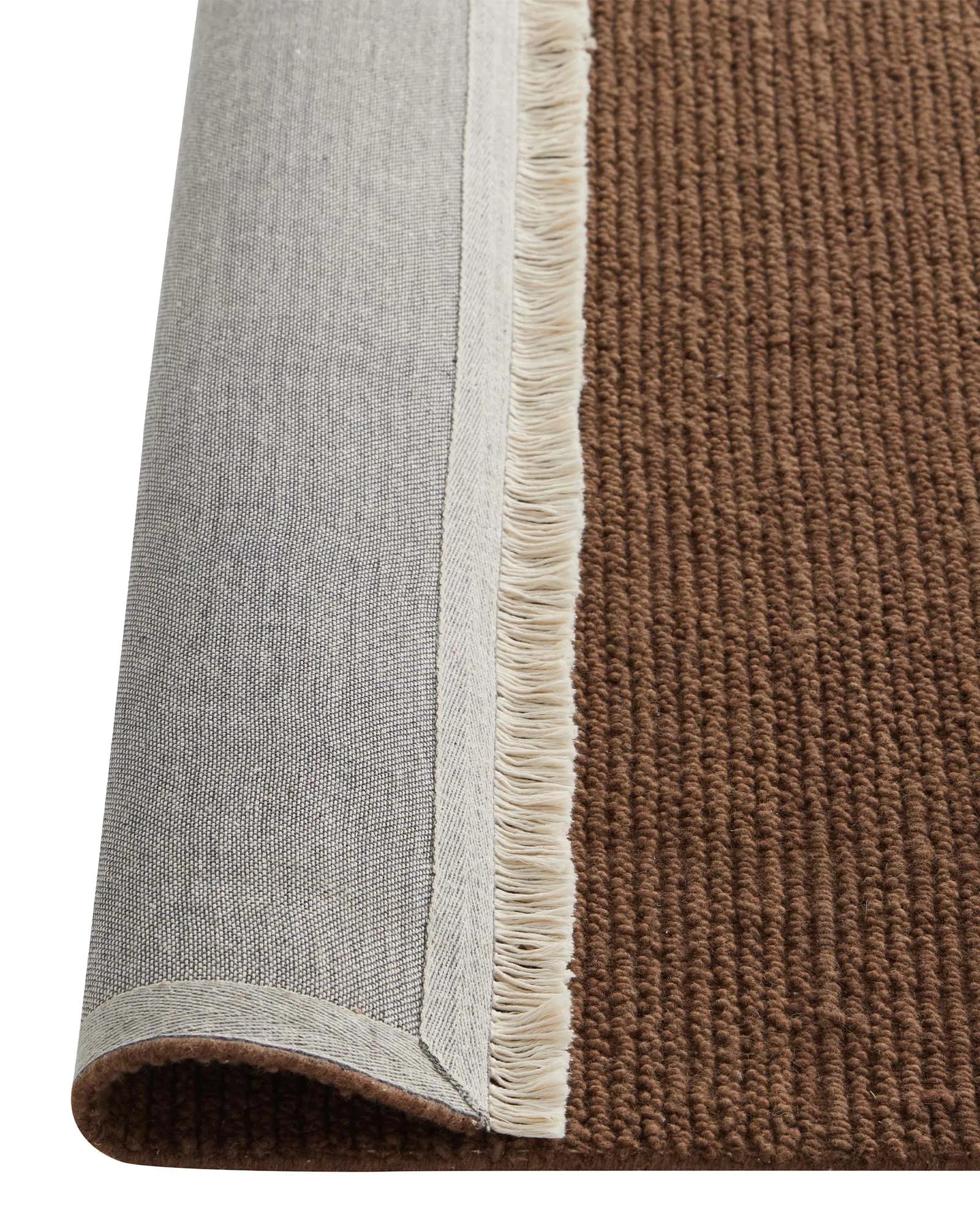 Fabien Bark textured wool rug detail, showing ribbed weave construction and cream fringe edge by Weave Home