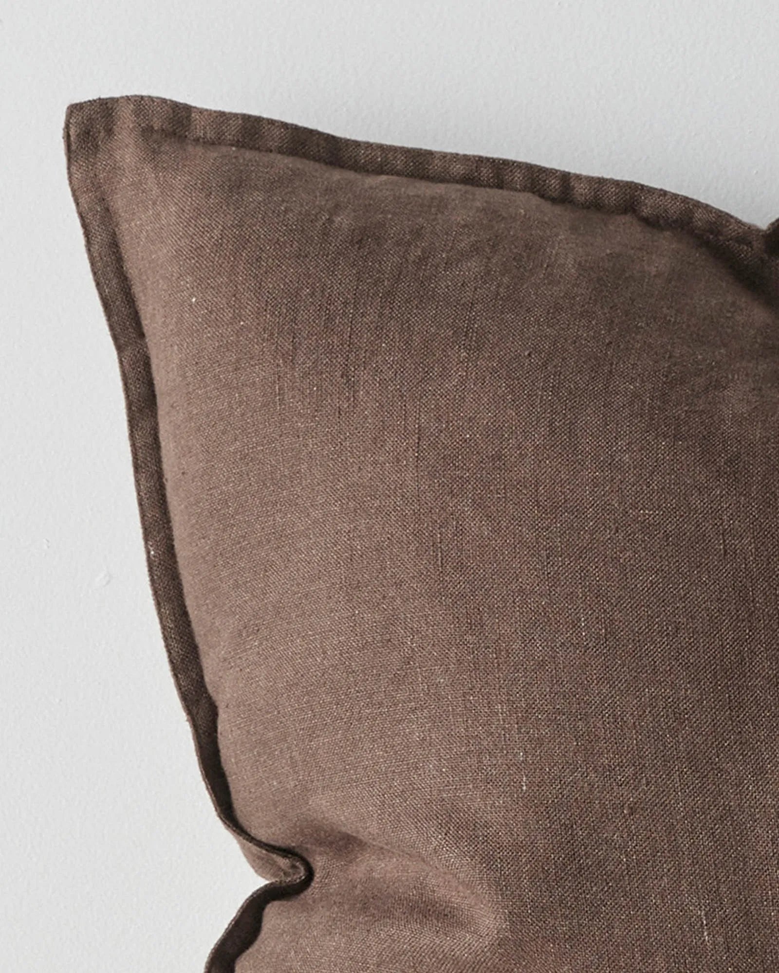 Como Cocoa linen cushion close-up, showing stone-washed European linen texture and warm chocolate brown colour by Weave Home