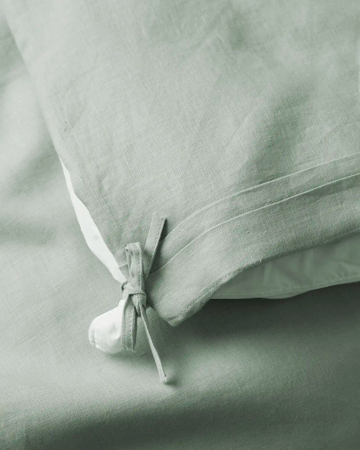 Ravello Quilt Cover in Sage, close-up of internal tie detail securing quilt, European linen by Weave Home