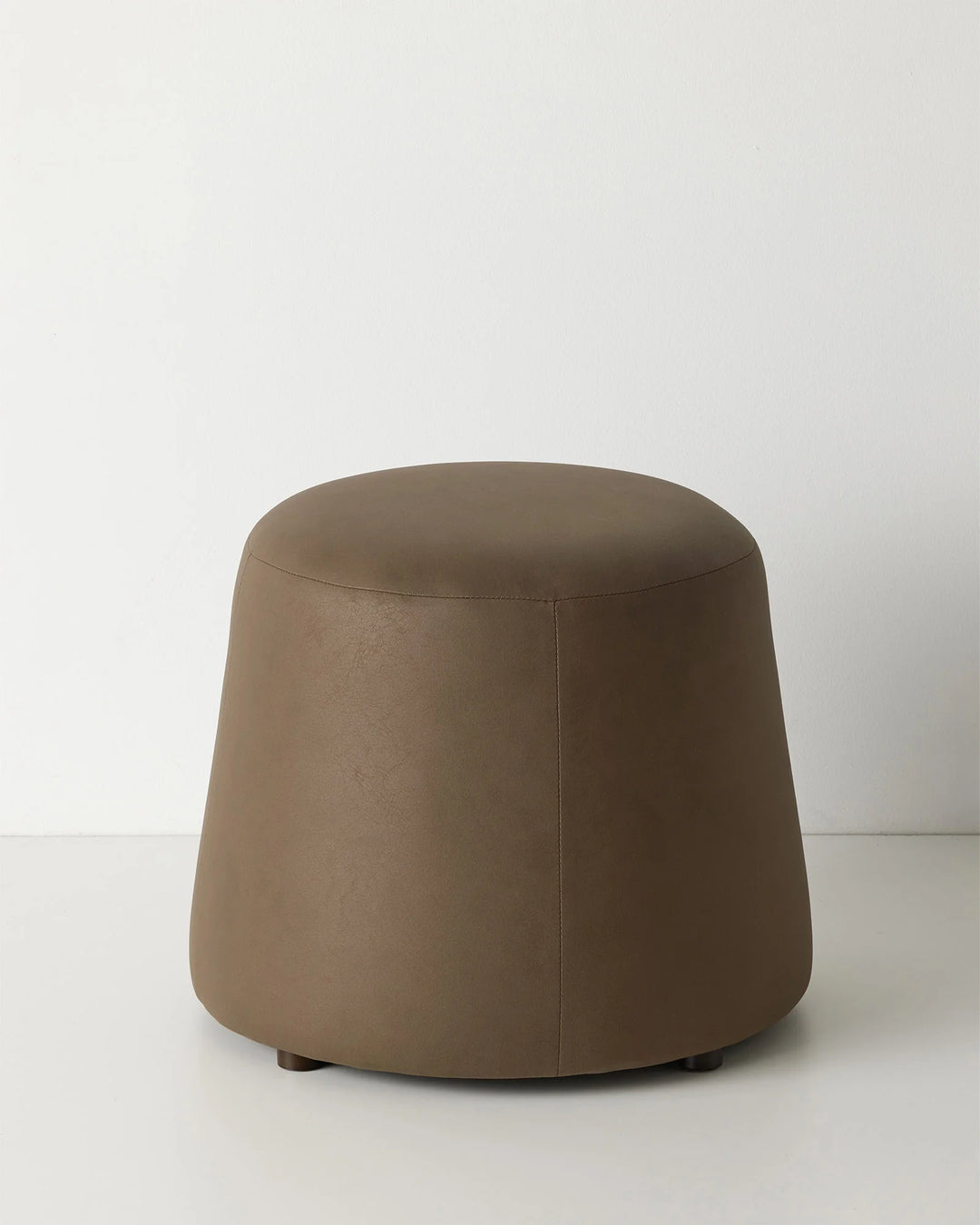 Landro Mocha ottoman in warm chocolate brown with soft leather-look polyester upholstery and sculptural dome shape by Weave Home