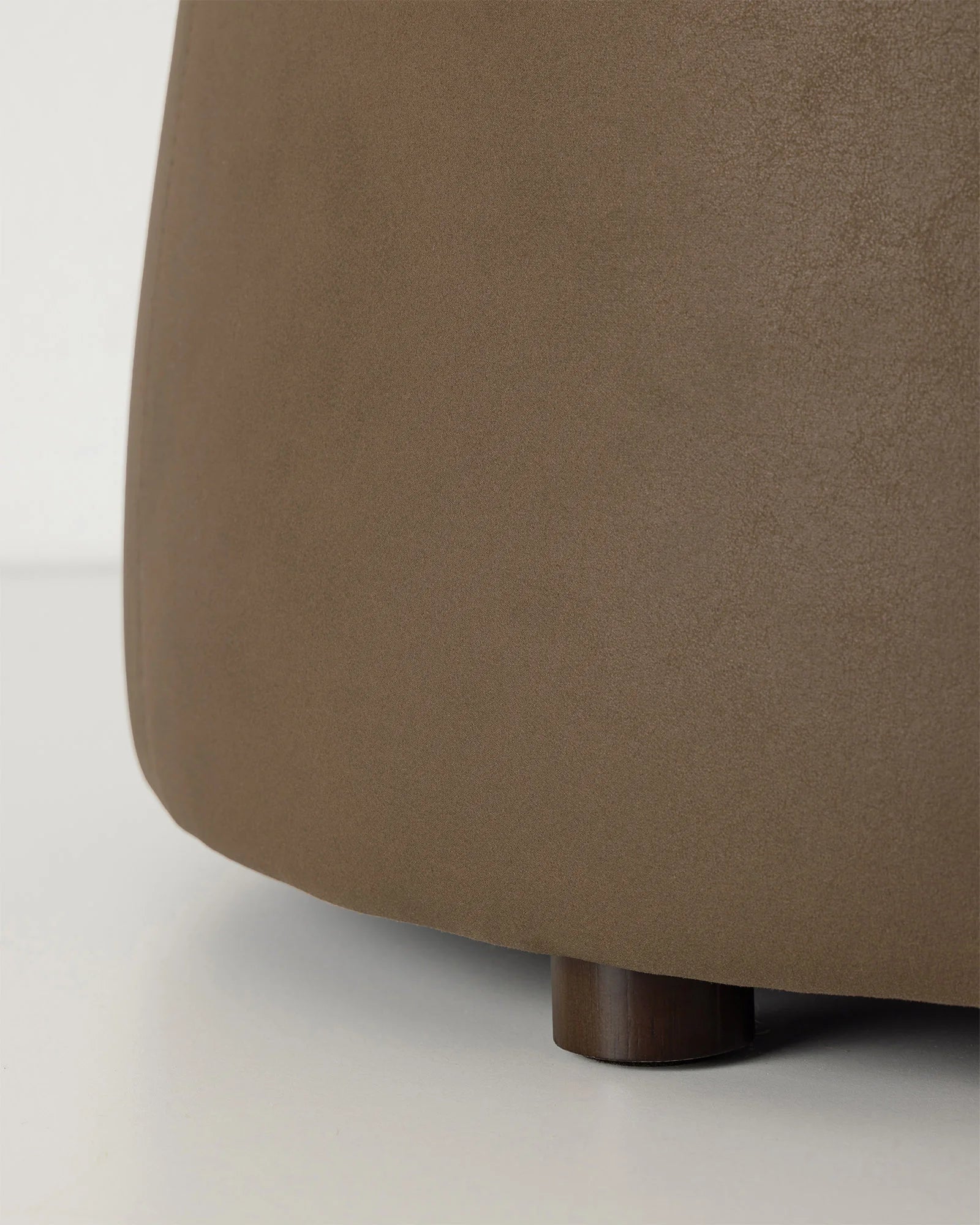 Landro Mocha ottoman, soft polyester in warm chocolate brown with leather-look grain texture, sculptural dome silhouette detail, by Weave Home