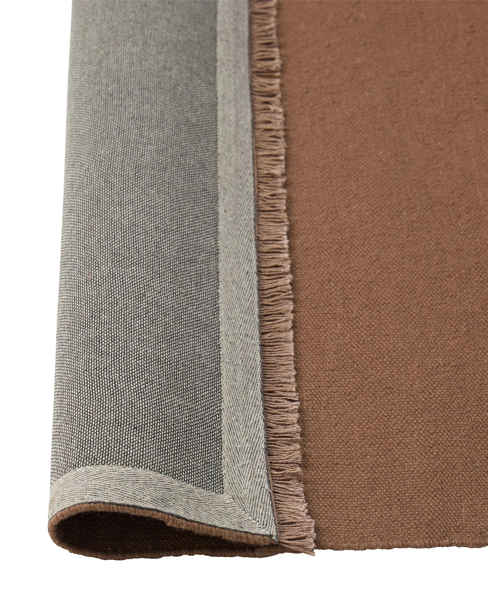 Jacqueline Rosewood wool rug detail, showing flatweave construction with fringed edge and two-tone colourway by Weave Home