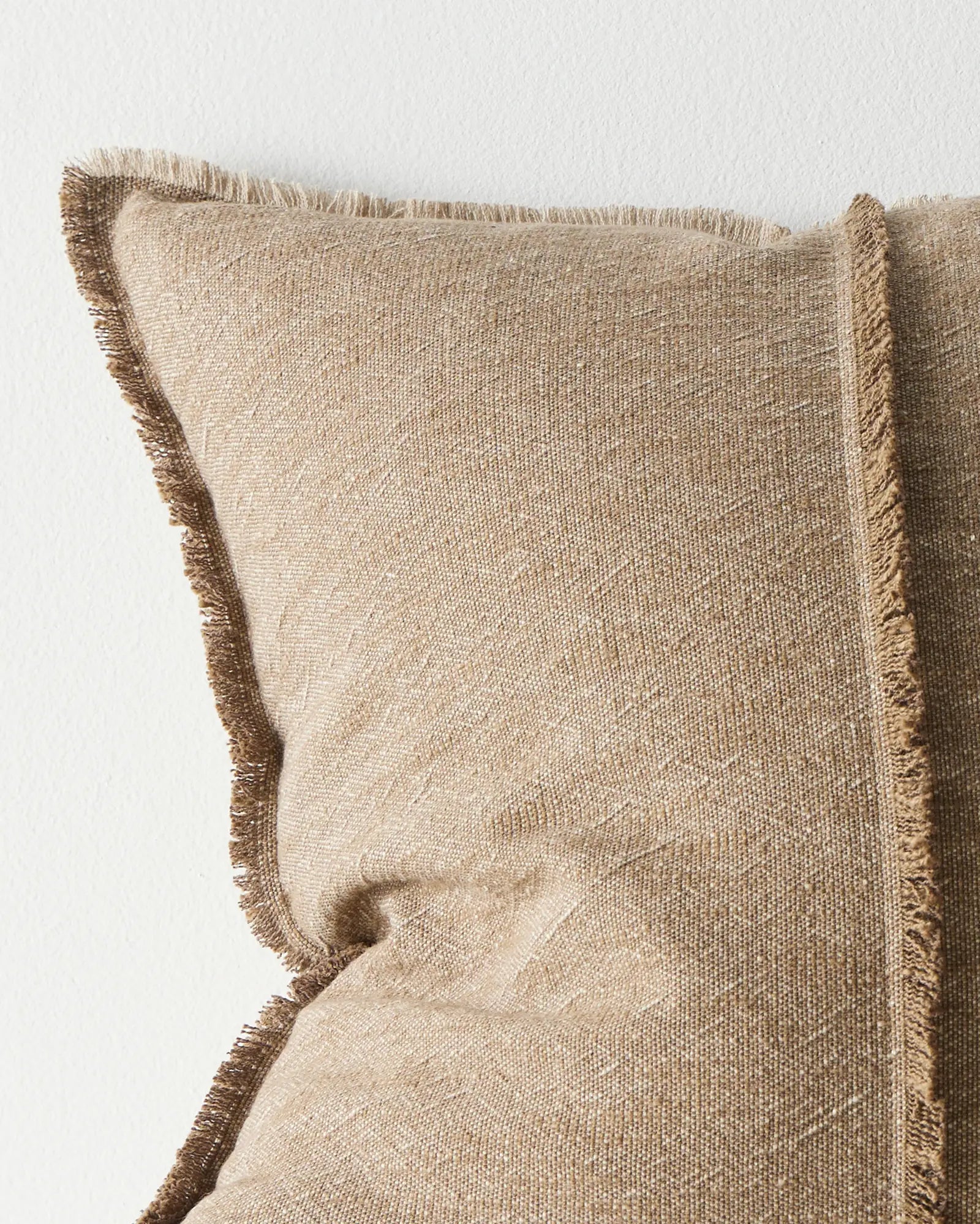 Adela Cocoa cotton linen cushion detail, showing raw-edge fringe border and textured weave close-up by Weave Home