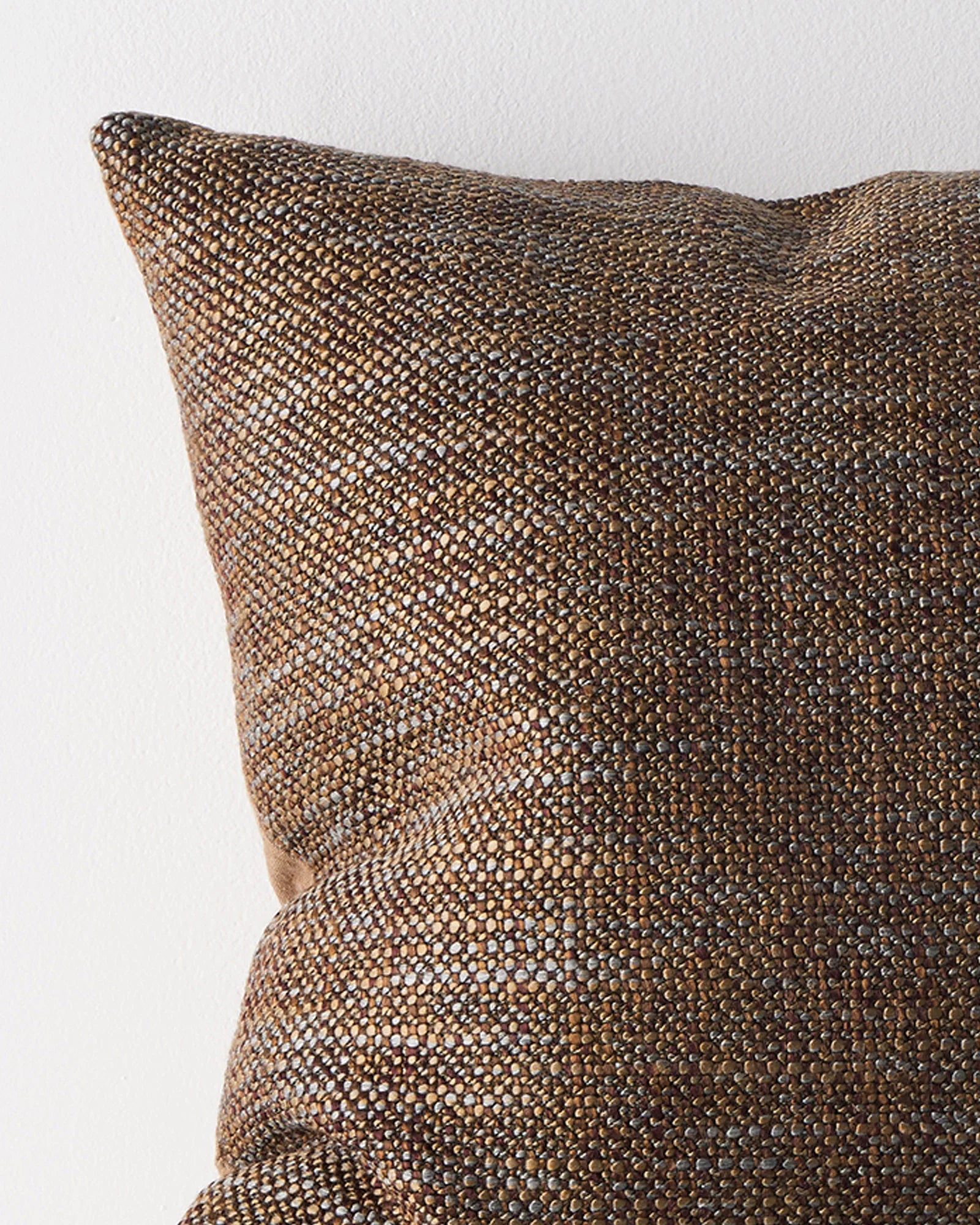 Castel Auburn cushion close-up showing chunky space-dyed weave in burgundy, terracotta and honey brown by Weave Home