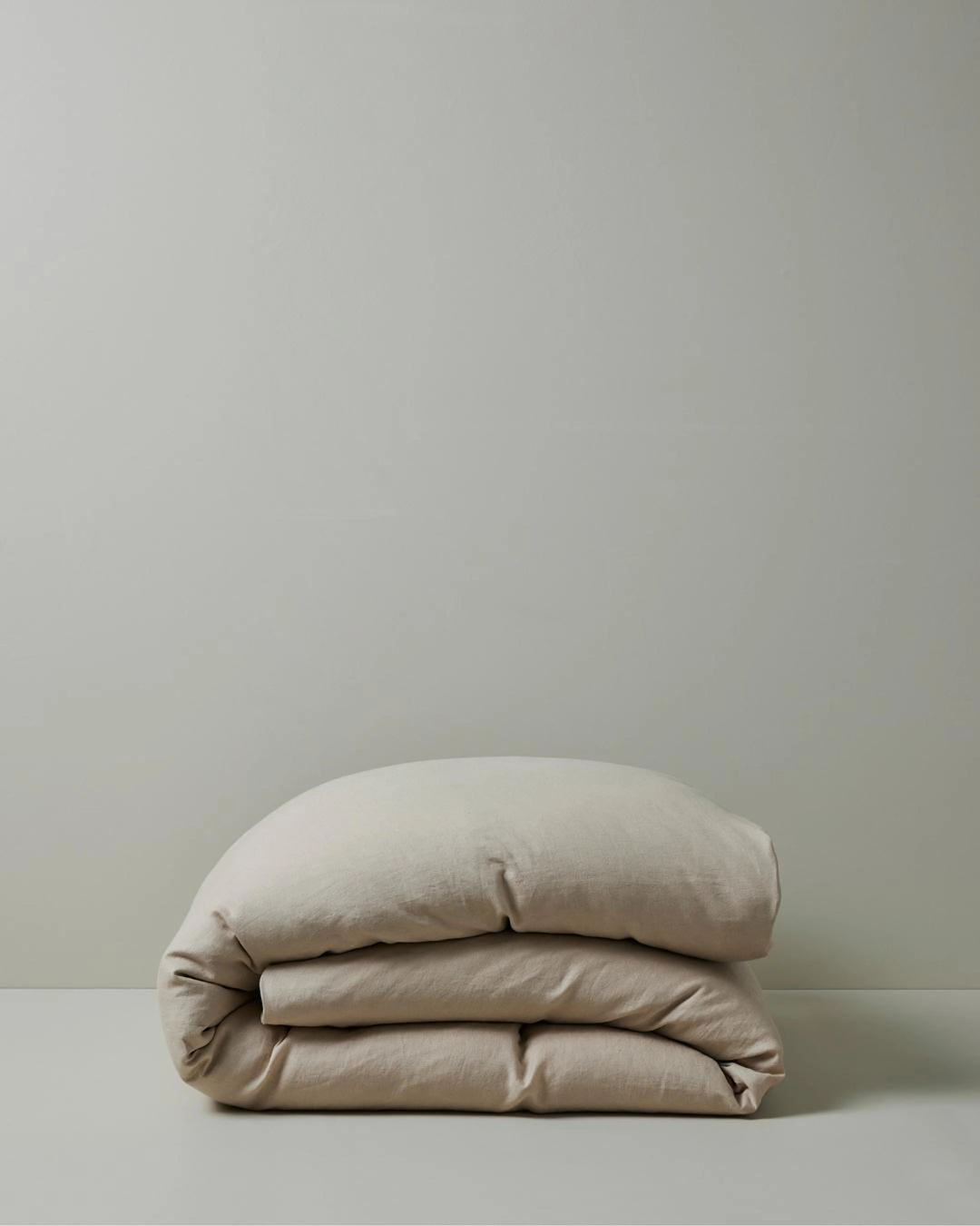Ravello Quilt Cover in Shell, European linen, folded display showing relaxed, prewashed texture by Weave Home
