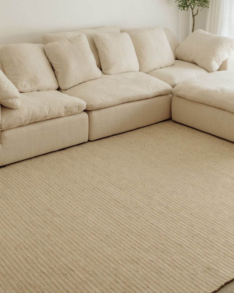 Andes Sandstorm wool-cotton rug in cream, ribbed weave texture with full cotton backing and edging, by Weave Home