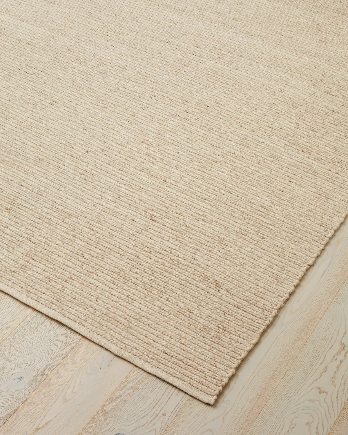 Andes Sandstorm rug corner detail, hand-woven wool-cotton blend with ribbed texture and cotton backing by Weave Home