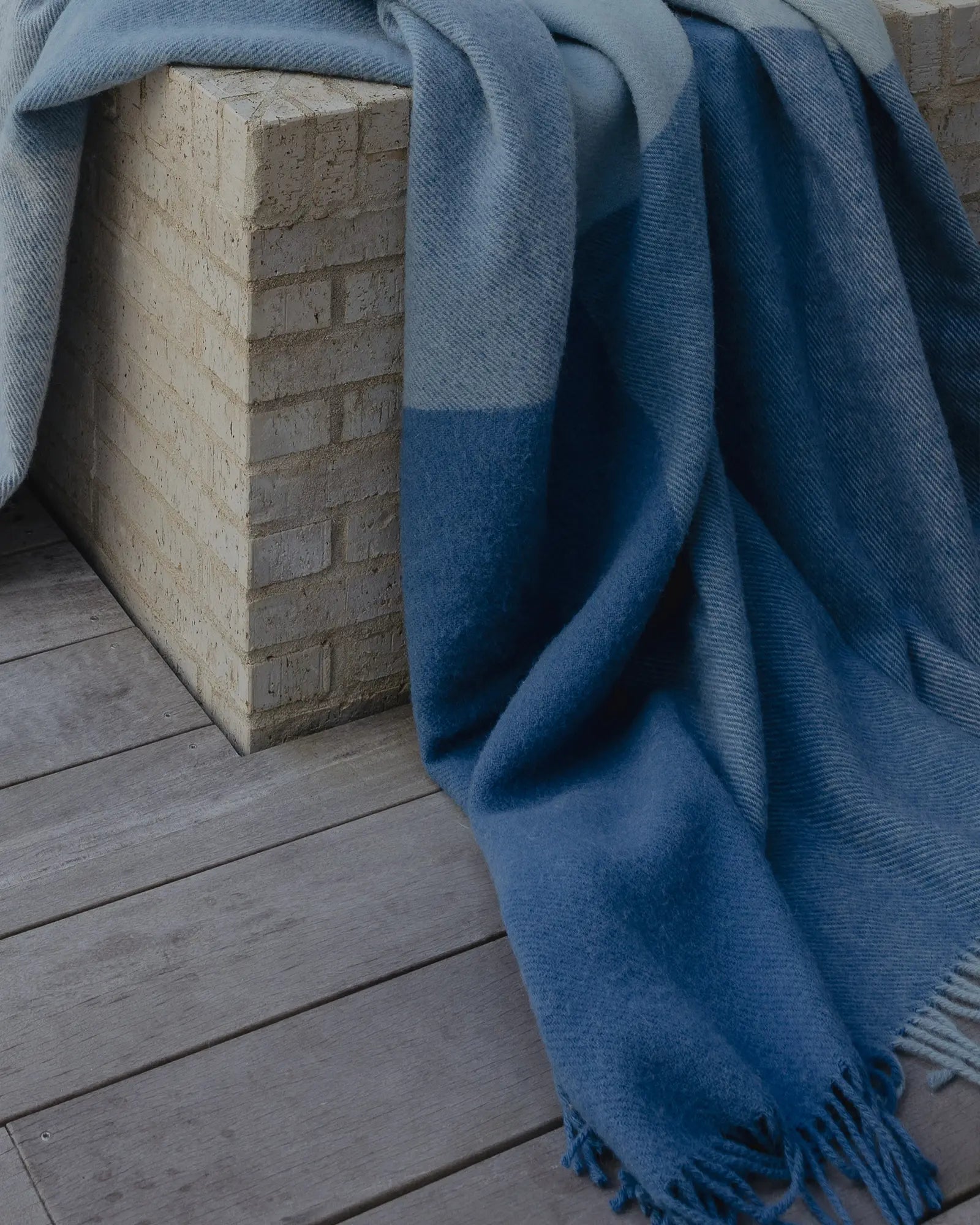 Bayswater Breeze throw in blue and white colourway, NZ wool with textured weave and fringe trim, close-up by Weave Home
