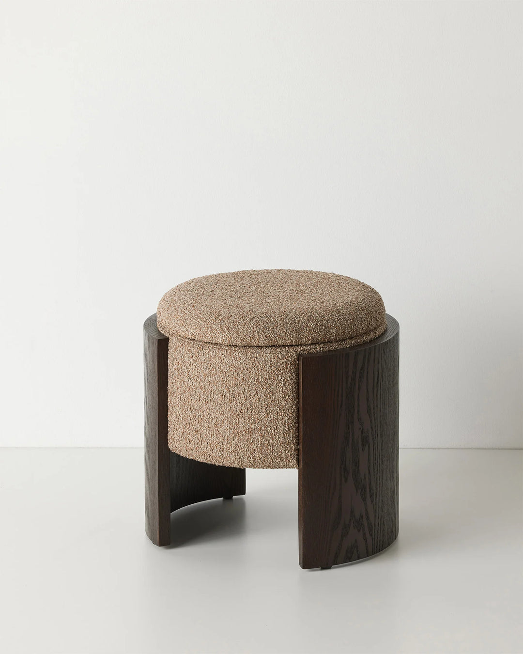 Norcia Sienna ottoman in multi-tonal bouclé with dark walnut ashwood legs, front view by Weave Home
