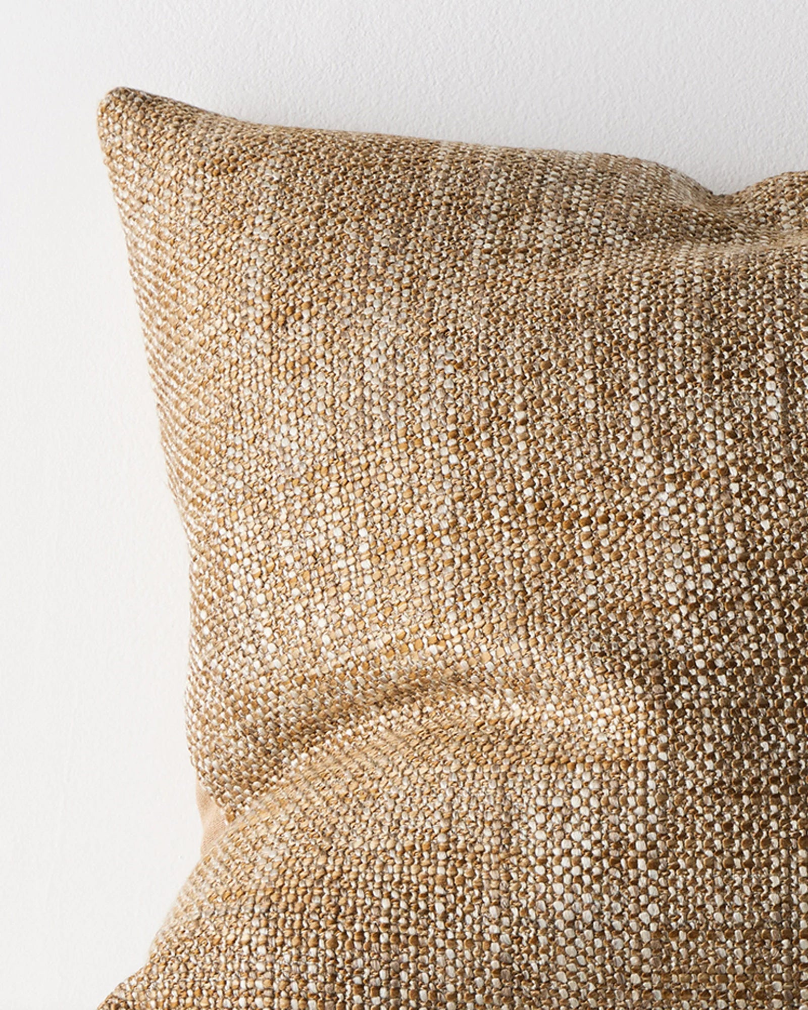 Castel Toffee cushion close-up, showing chunky space-dyed woven texture in honey, beige and brown by Weave Home