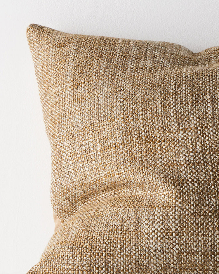 Castel Toffee cushion close-up, showing chunky space-dyed woven texture in honey, beige and brown by Weave Home