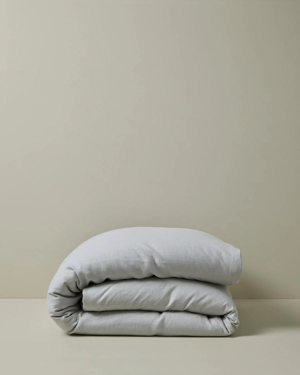 Ravello Quilt Cover in silver, folded to show the European linen fabric and relaxed texture by Weave Home