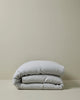 Ravello Quilt Cover in silver, folded to show the European linen fabric and relaxed texture by Weave Home