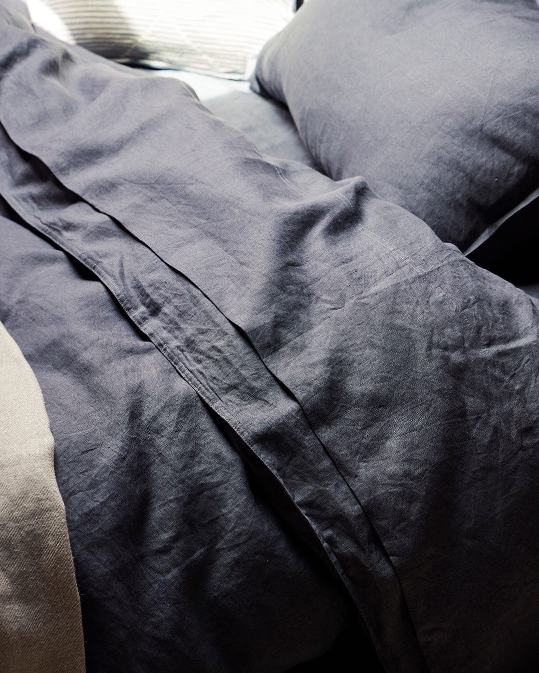 Ravello Flat Sheet in denim European linen, close-up detail showing soft prewashed weave and relaxed texture by Weave Home