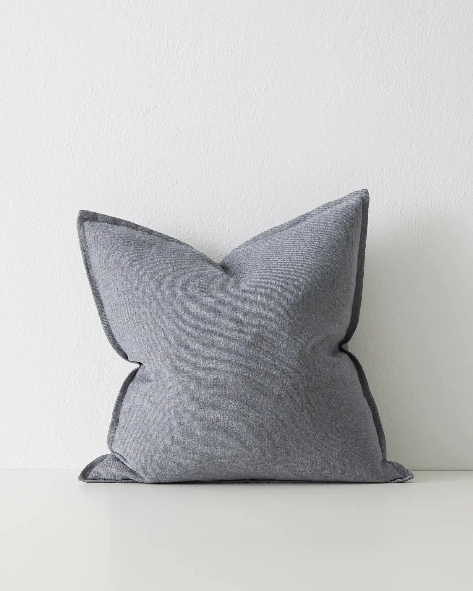 Fiore Denim 50x50 cushion in soft washed blue linen viscose blend with charcoal piping detail by Weave Home