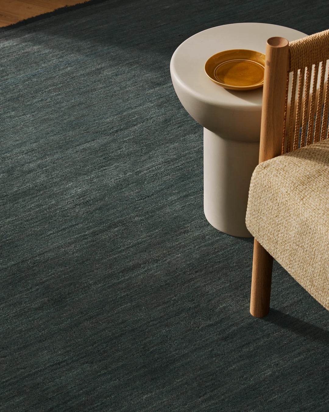 Silvio Dusk rug in deep muted blue, hand-woven with micro fringe border detail and textured sustainable styling by Weave Home