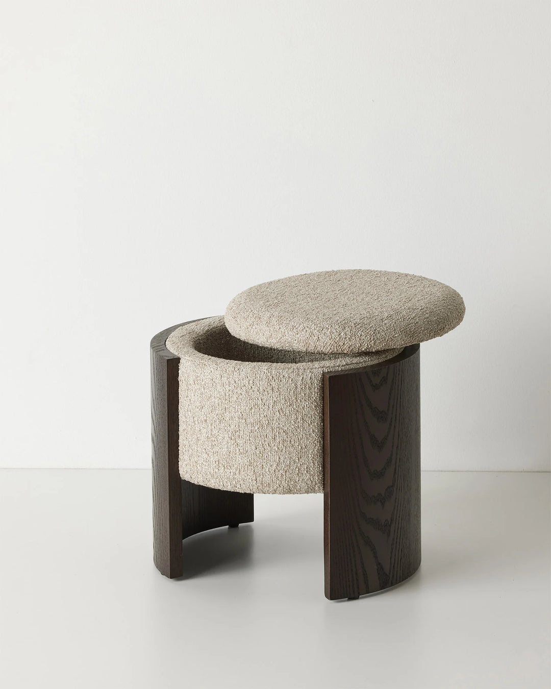 Norcia Stone bouclé ottoman with multi-tonal neutral upholstery and dark walnut ashwood base, featuring concealed storage lid by Weave Home