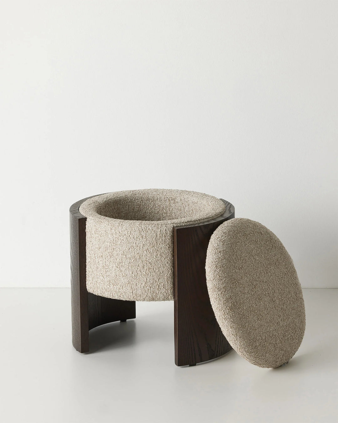 Norcia Stone bouclé ottoman with removable lid, neutral multi-tonal boucle upholstery and dark walnut ashwood panel legs by Weave Home