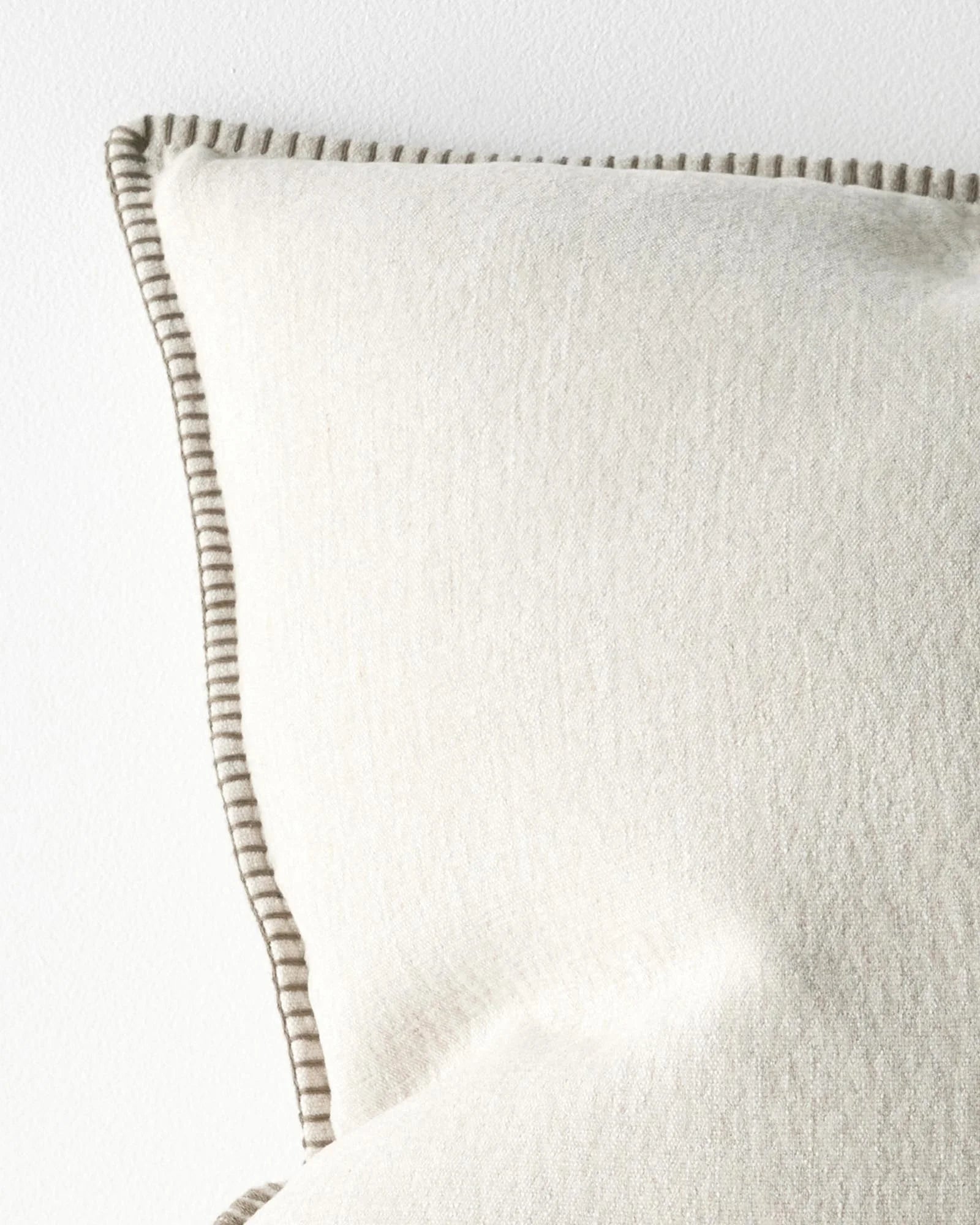 Alba Bone 50x50 cushion, linen polyester blend, detail view of blanket stitch edge in warm beige by Weave Home