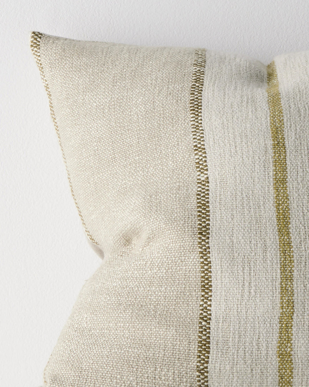 Ottavio Willow cushion close-up detail showing chunky slub weave with olive and lime striped piping against cream linen polyester blend by Weave Home