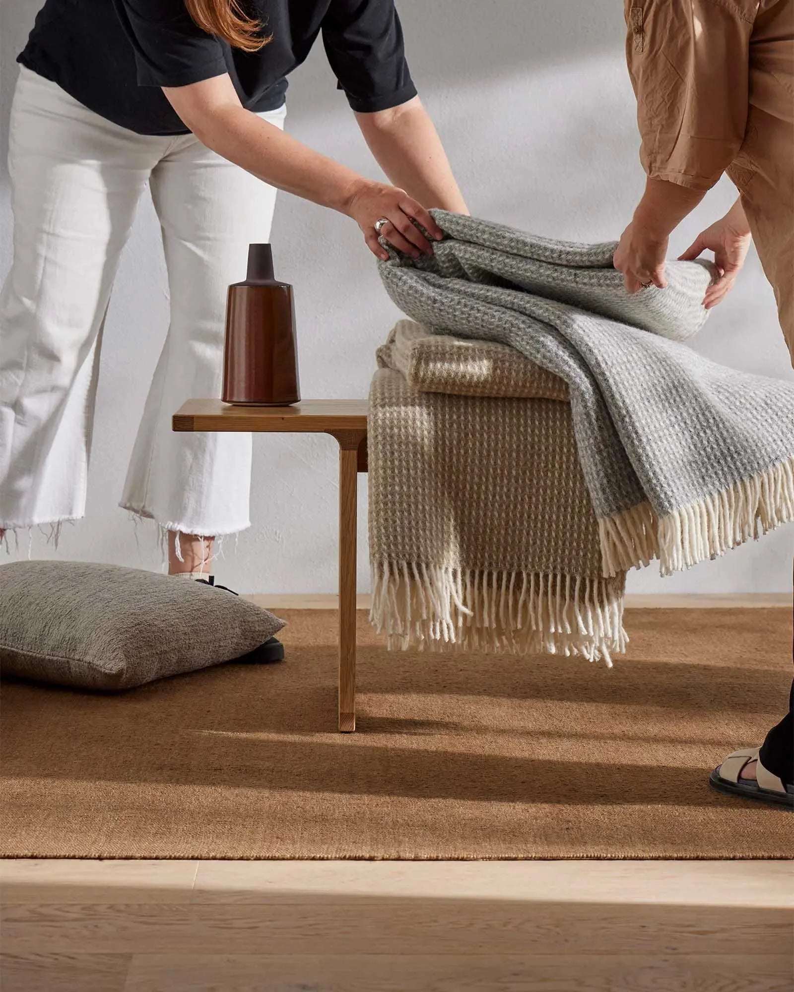 Breckon Hazel waffle weave wool throw in warm taupe with fringe trim, displayed folded by Weave Home