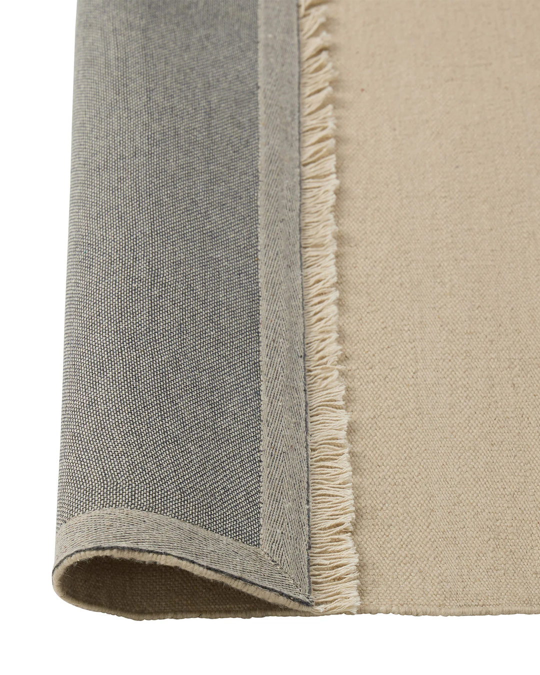 Jacqueline Cashew flatweave wool rug detail, showing fringe border and tonal neutral weave by Weave Home
