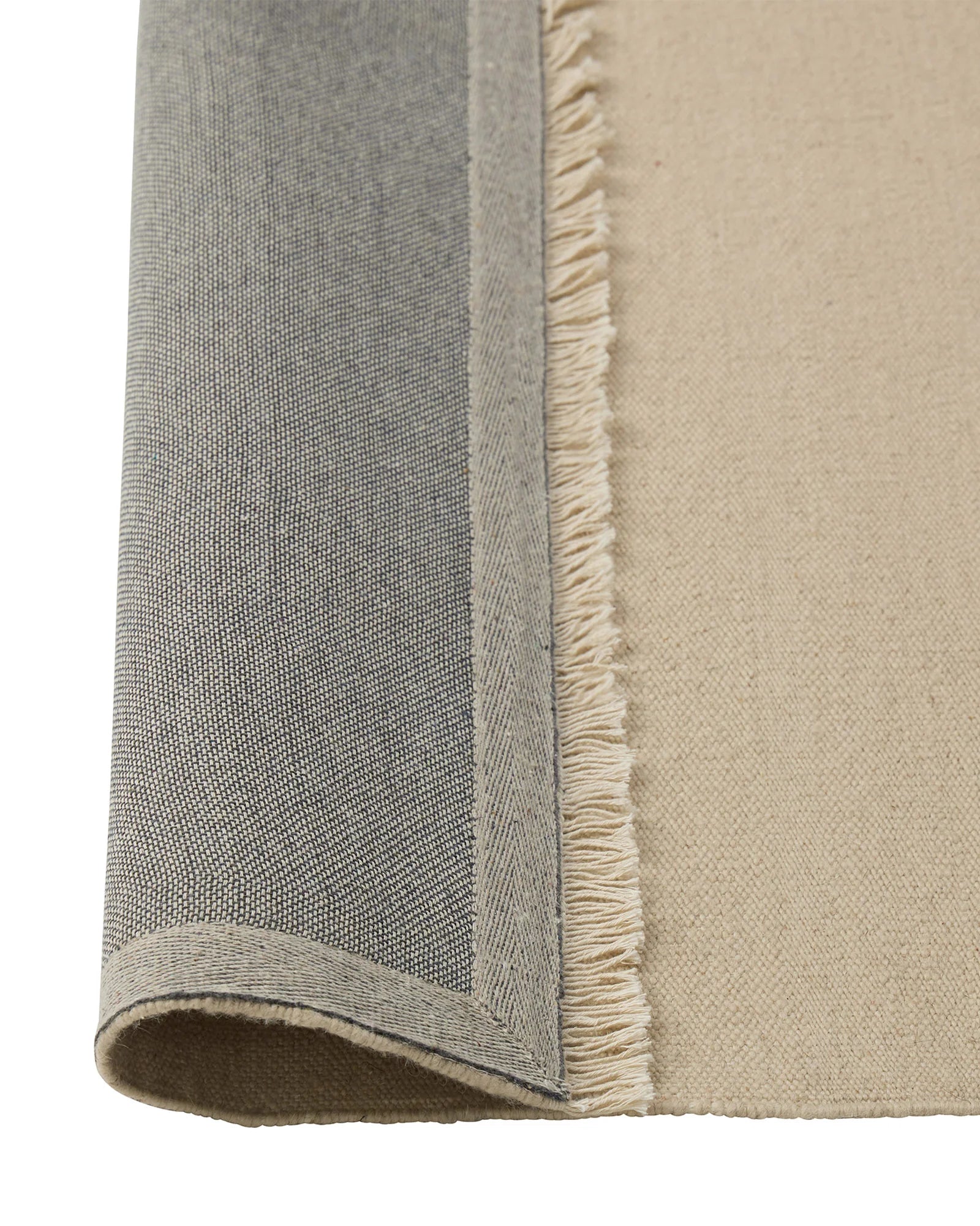 Jacqueline Cashew flatweave wool rug detail, showing fringe border and tonal neutral weave by Weave Home