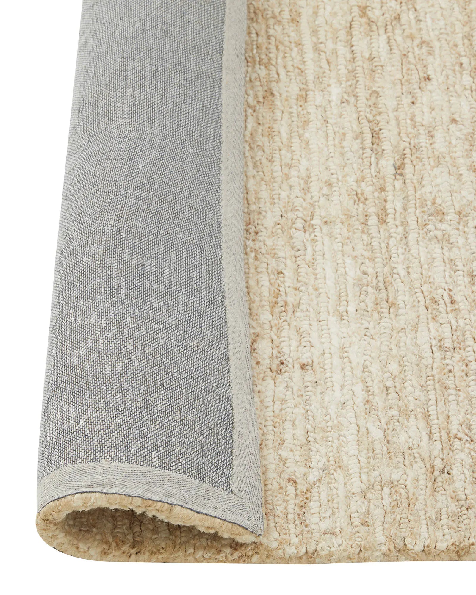 Bastian Macadamia jute rug detail view showing looped and cut linear texture weave with grey binding, by Weave Home