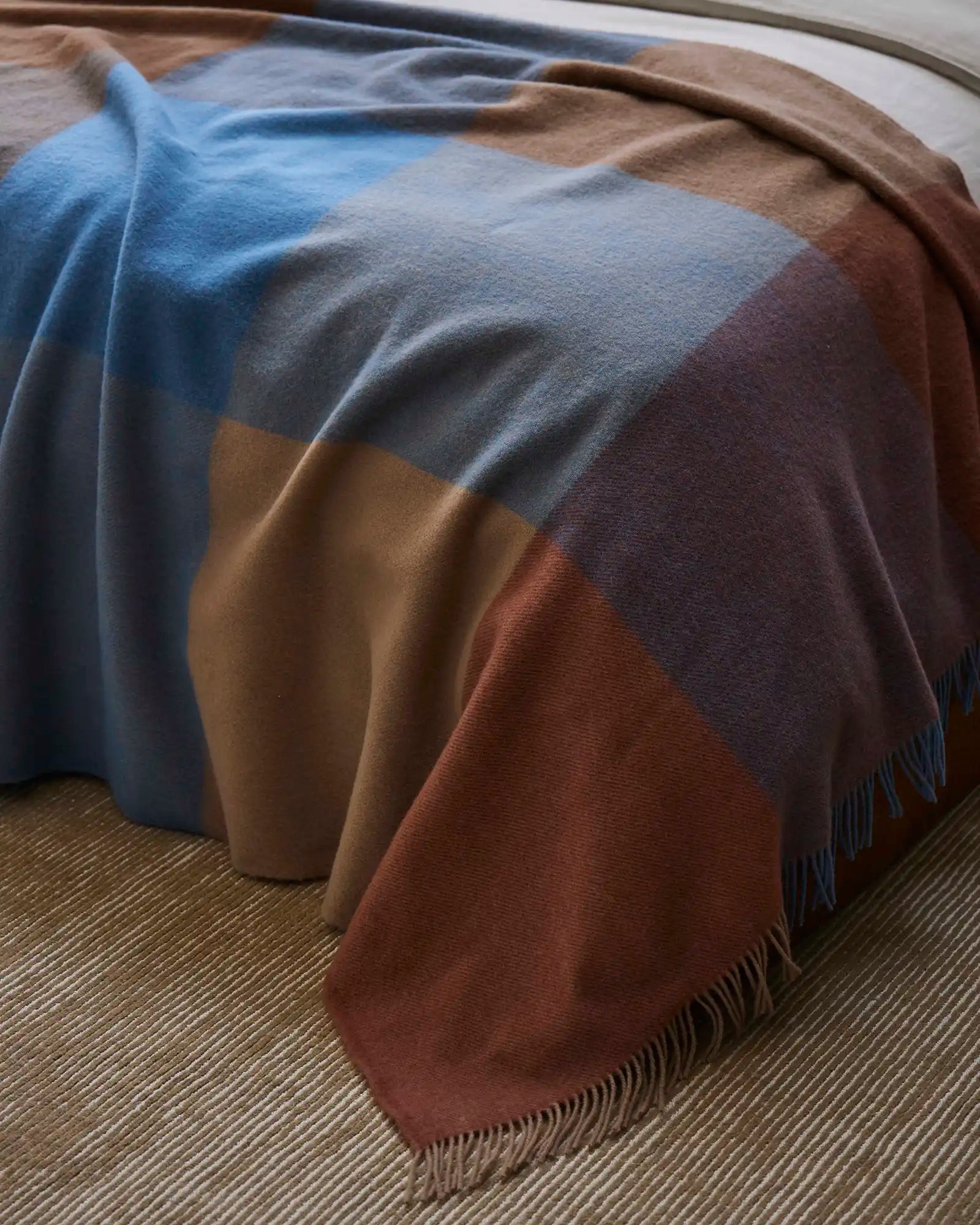 Brookside Ocean wool throw in cornflower blue, oak, rust and tan colourblock design with fringe edges by Weave Home