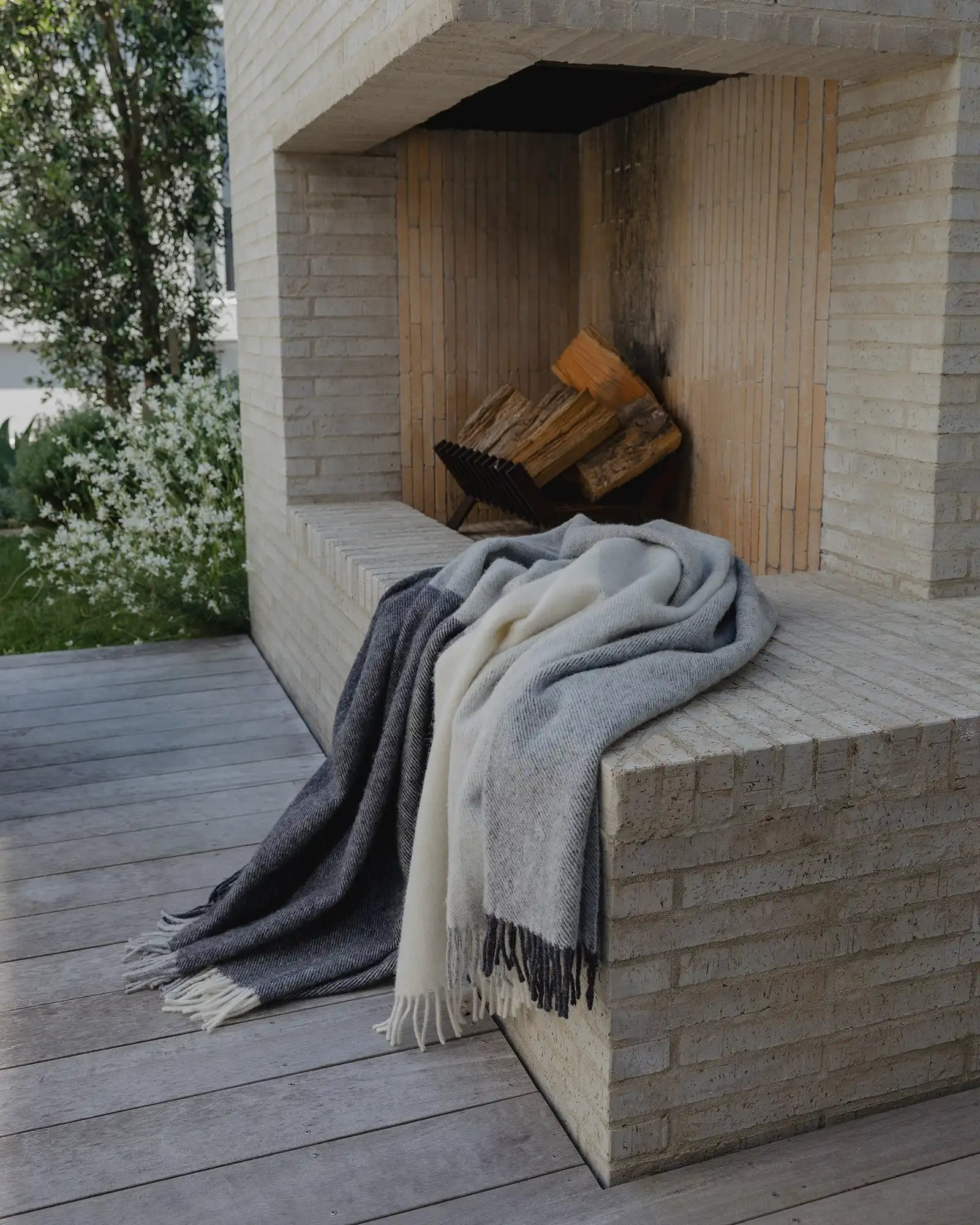 Bayswater Charcoal throw in NZ wool, featuring light grey, white and dark charcoal colourway with fringe trim, by Weave Home