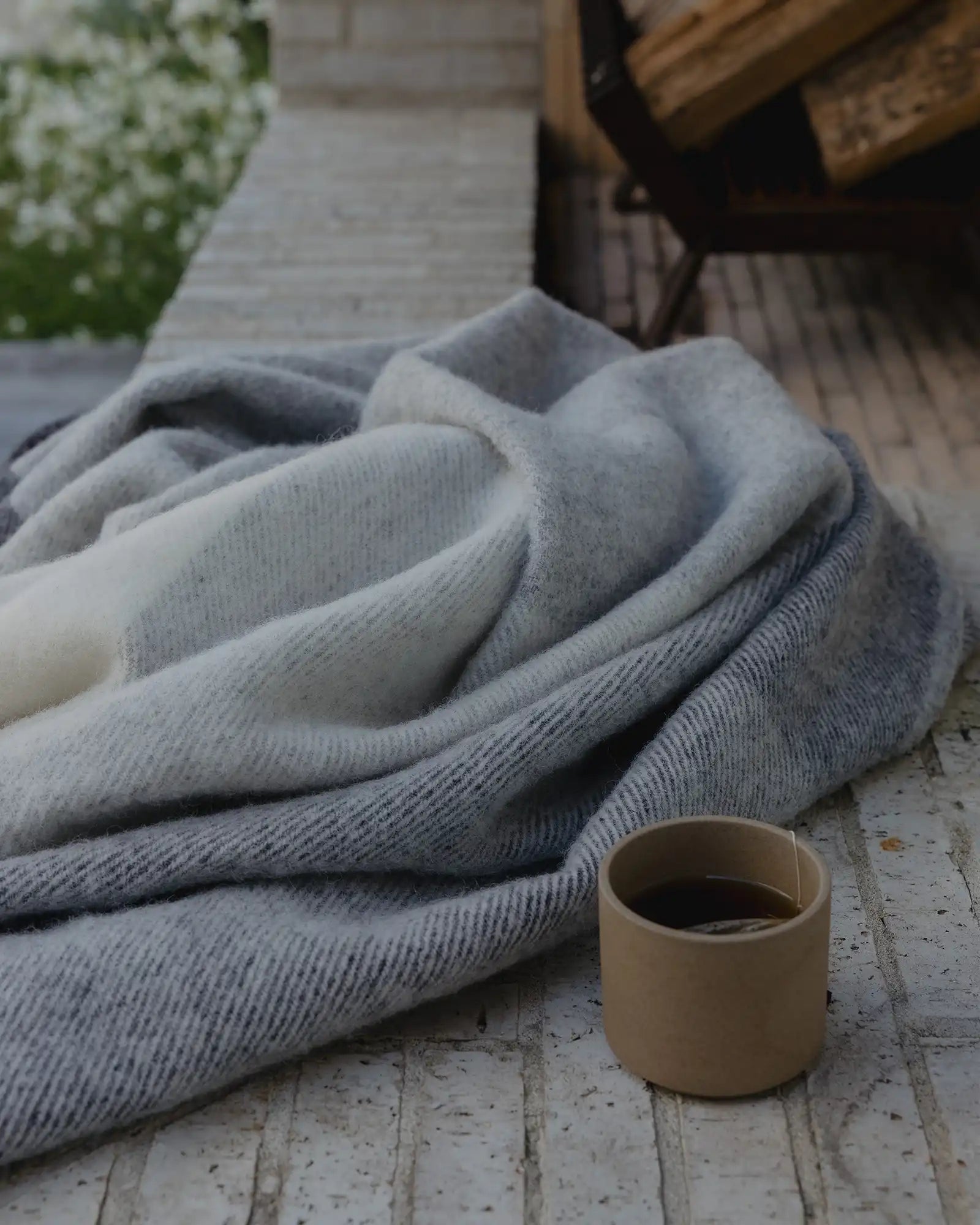 Bayswater Charcoal throw in mixed greys, detail of soft woven NZ wool texture and drape by Weave Home