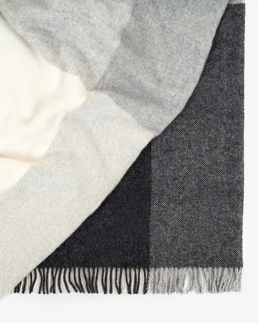 Bayswater Charcoal throw detail, NZ wool twill weave in grey, white and charcoal with fringed edge by Weave Home