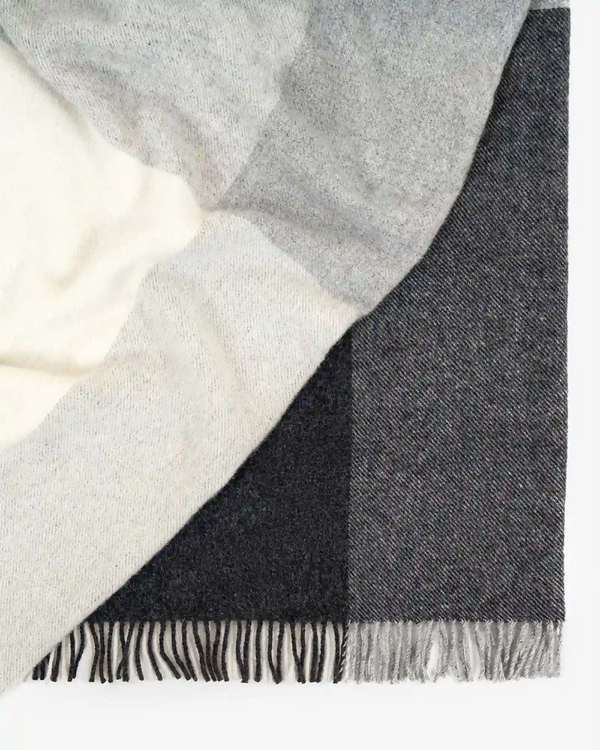 Bayswater Charcoal throw detail, NZ wool twill weave in grey, white and charcoal with fringed edge by Weave Home