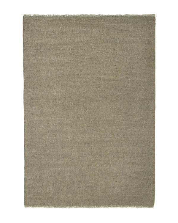 Jacqueline Pumice rug in soft taupe grey with sage green undertones, flatweave wool construction with raw fringe border by Weave Home