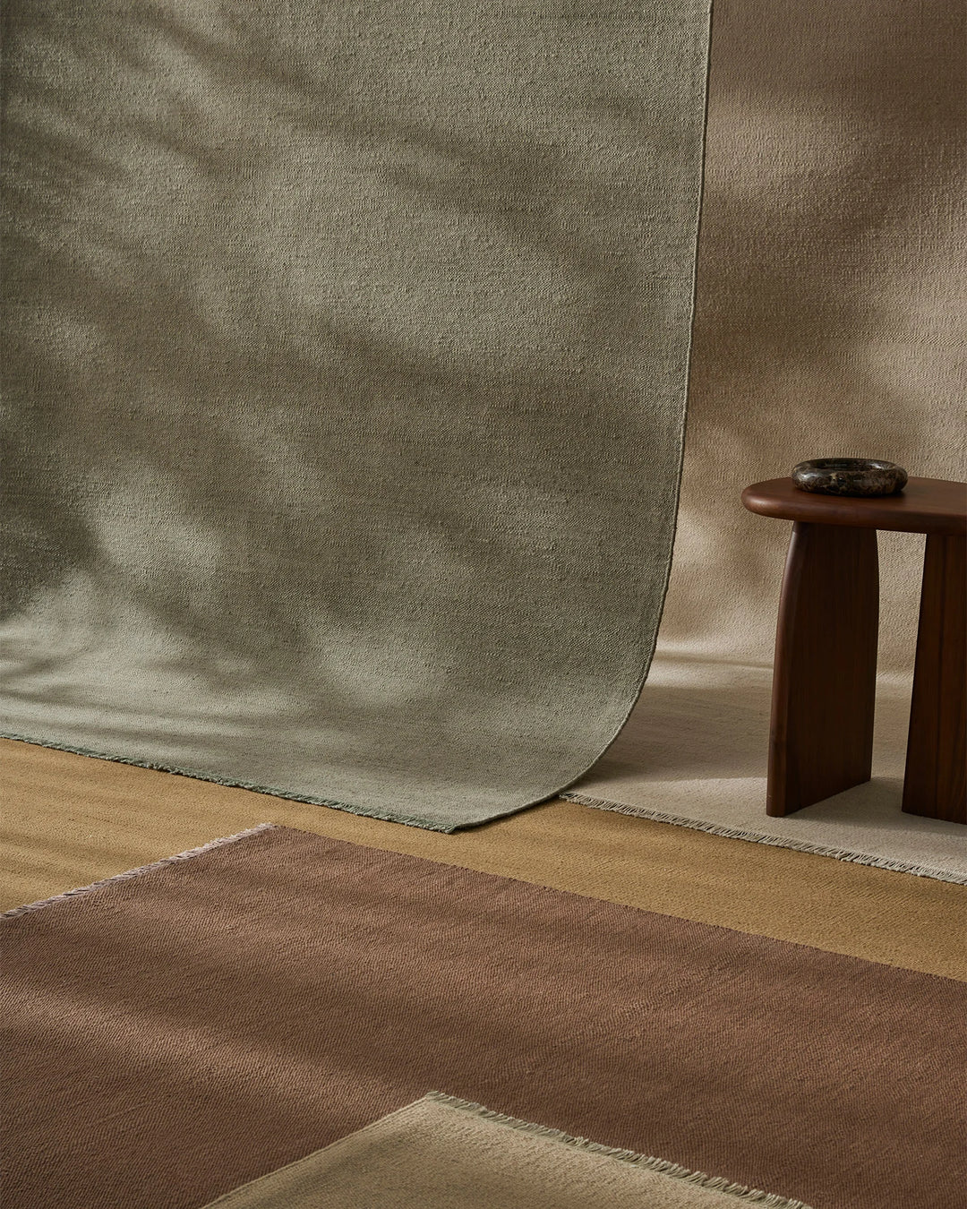 Jacqueline Pumice wool rug in soft taupe grey with sage undertones, flatweave construction, layered styling by Weave Home