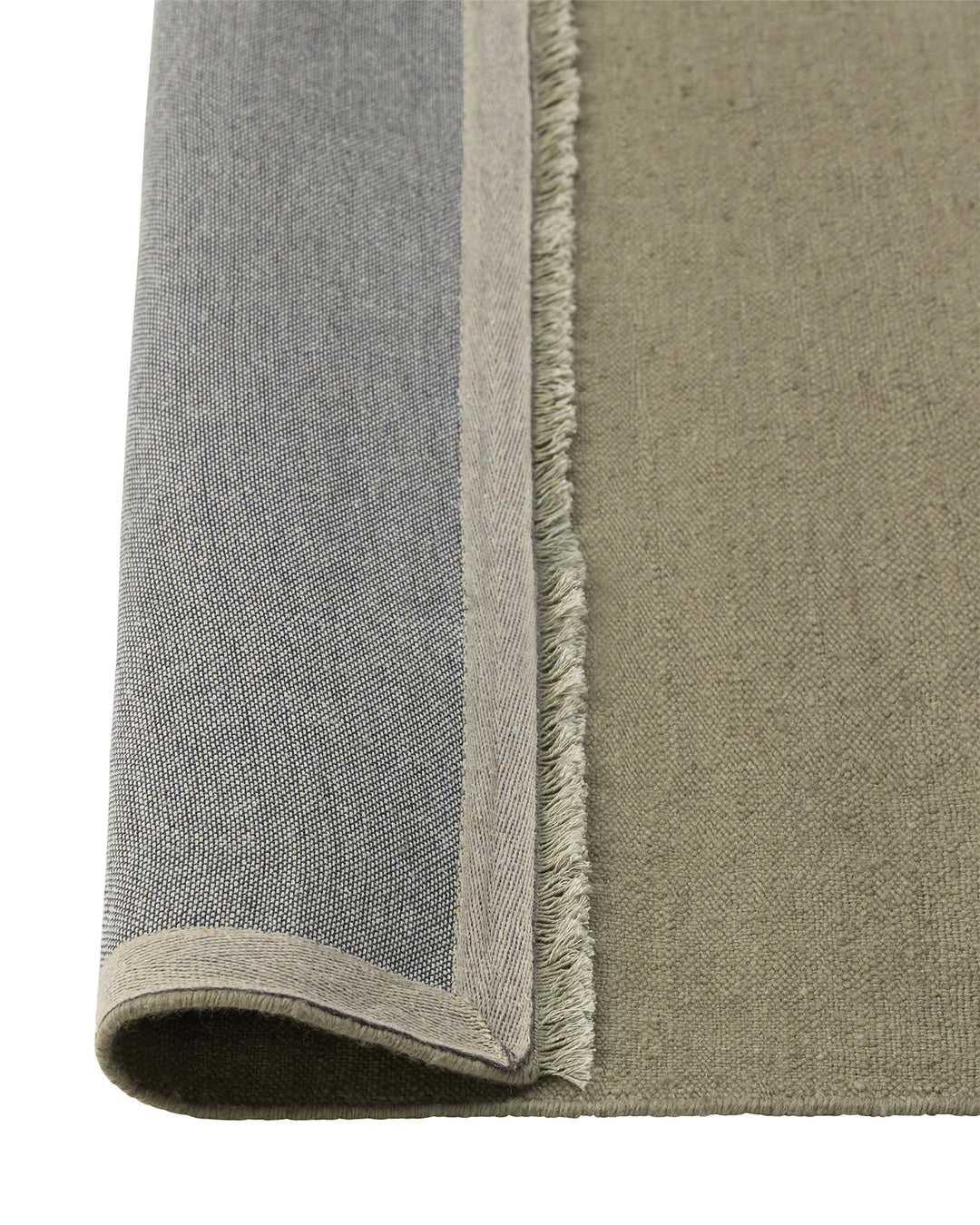 Jacqueline Pumice wool rug detail, showing flatweave construction with fringed edge and taupe-grey colorway by Weave Home