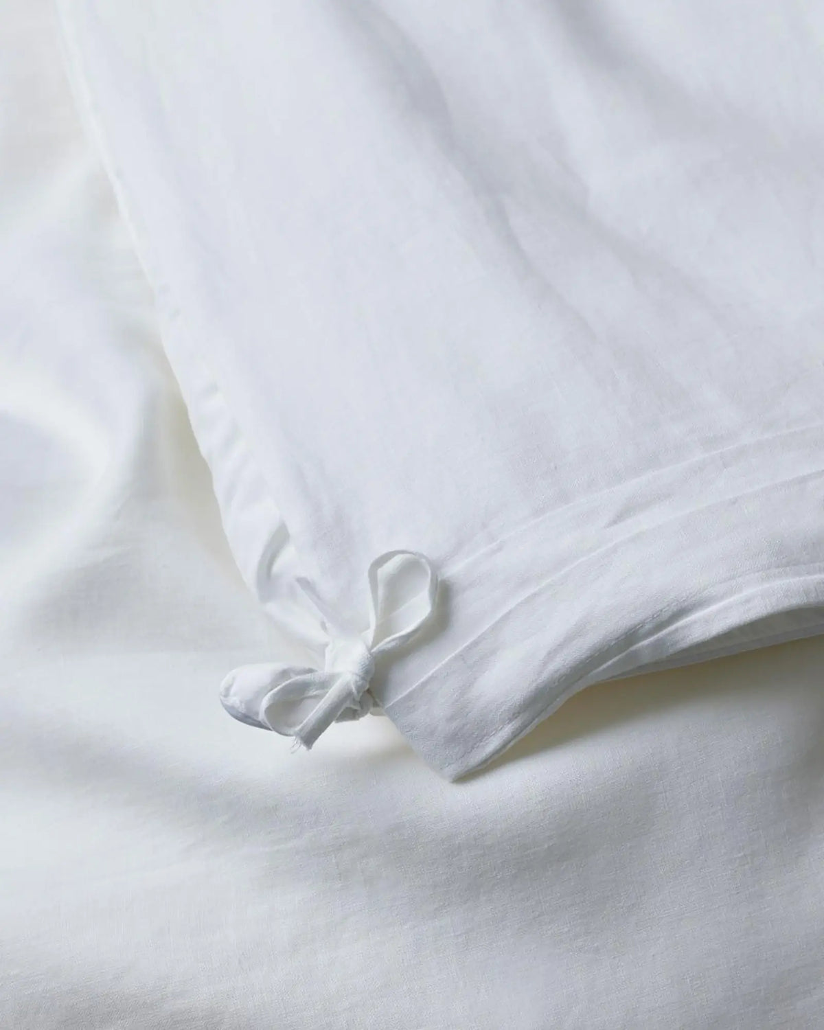 Ravello Quilt Cover White detail view showing internal fabric ties securing quilt, European linen by Weave Home