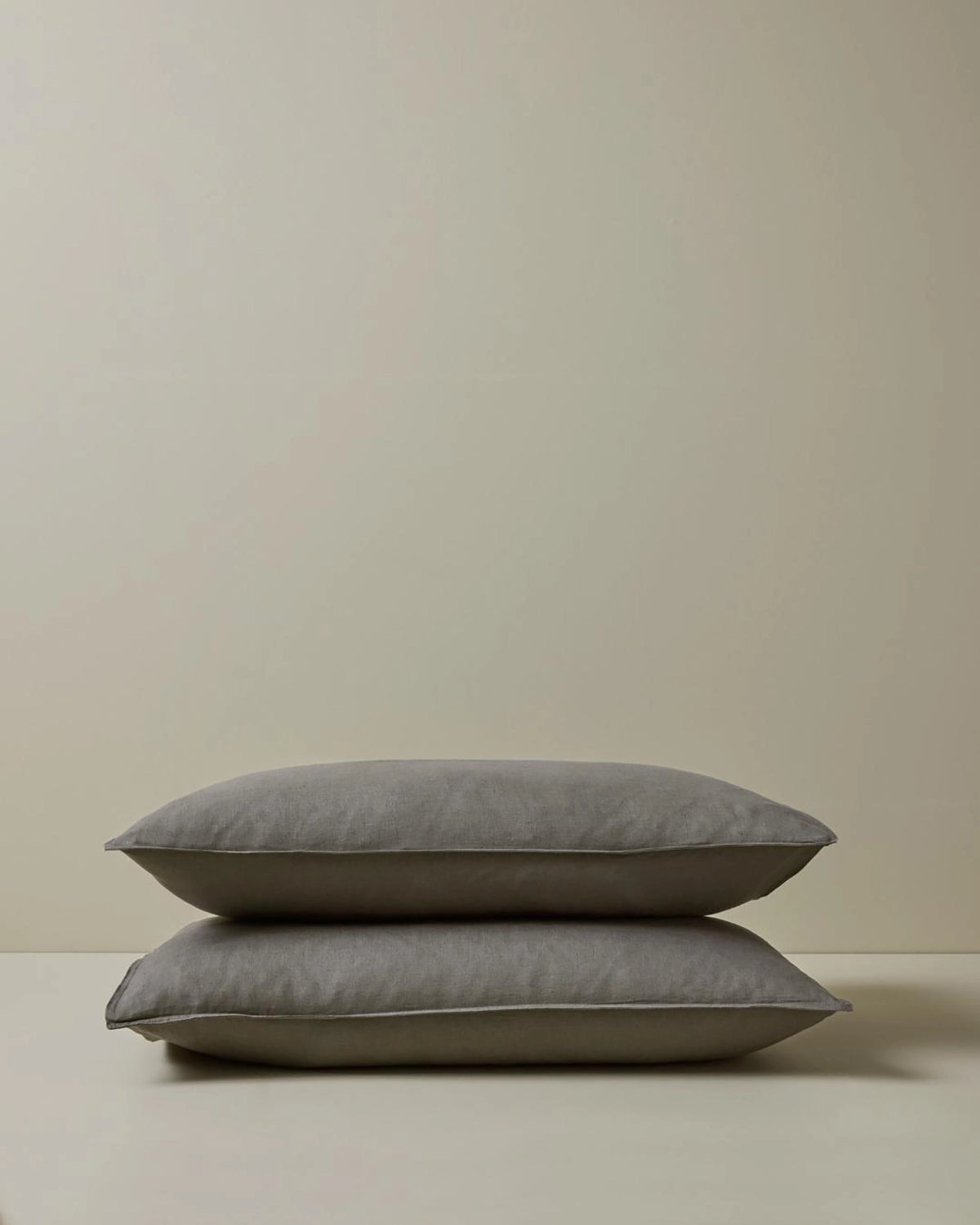 Ravello Pillowcase Set in Charcoal, stacked pair showing top-stitched flanged edge detail, European linen by Weave Home