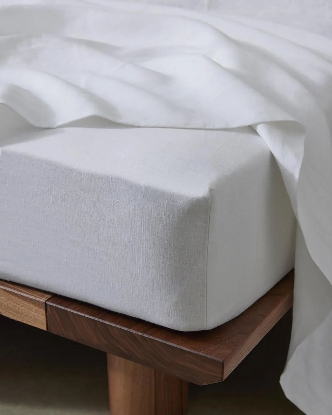 Ravello Fitted Sheet in white European linen, corner view showing deep pocket and textured weave by Weave Home