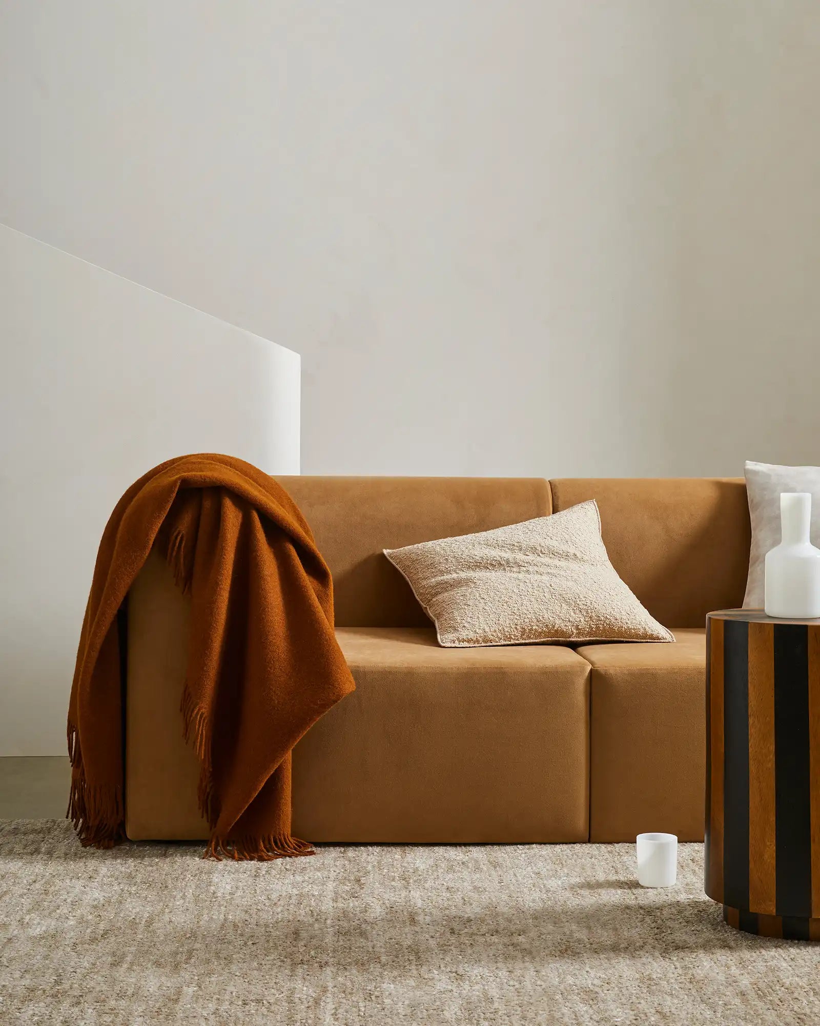 Alberto Nougat bouclé cushion, 50x50cm, with babylock edge and concealed zipper, styled on caramel sofa by Weave Home