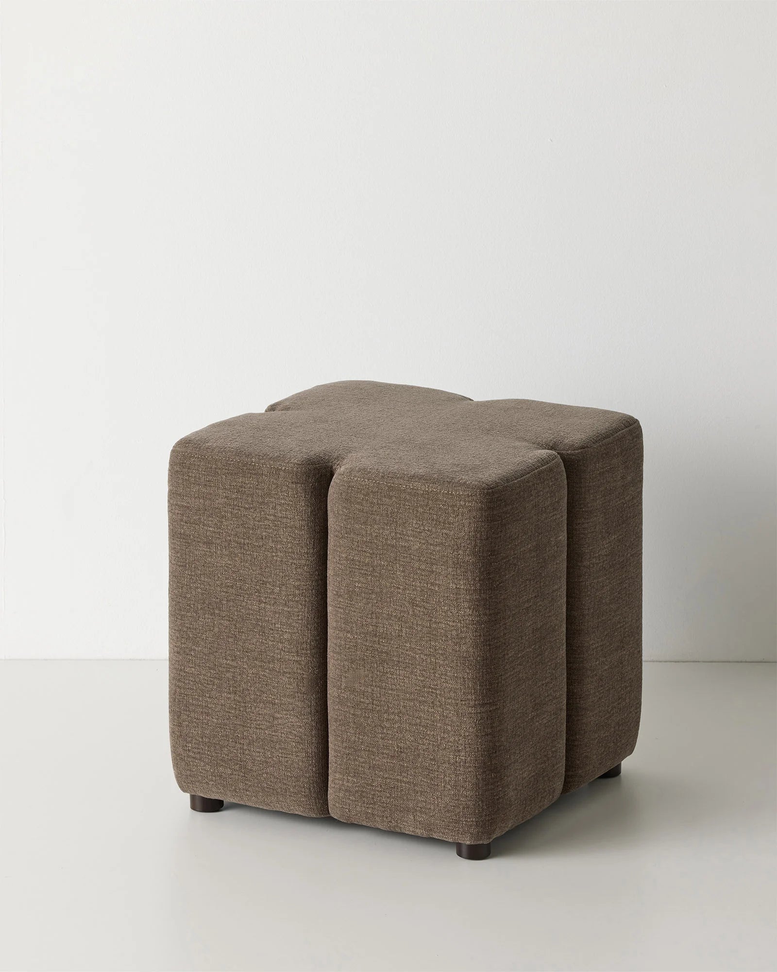 Campello Bark ottoman with clover-shaped silhouette in chocolate brown micro chenille, front view by Weave Home